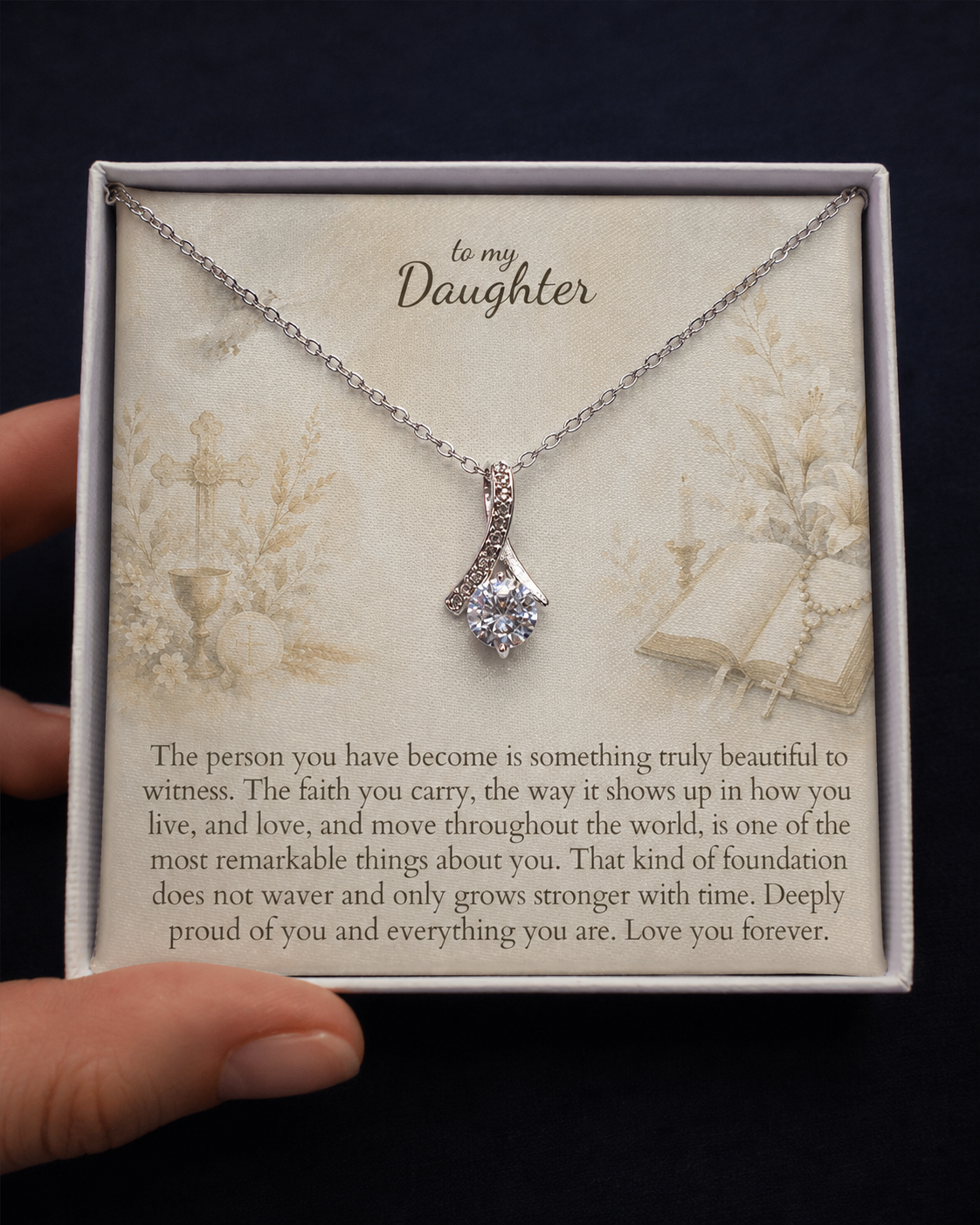 Necklace with a message card for 'Daughter' on a dark background